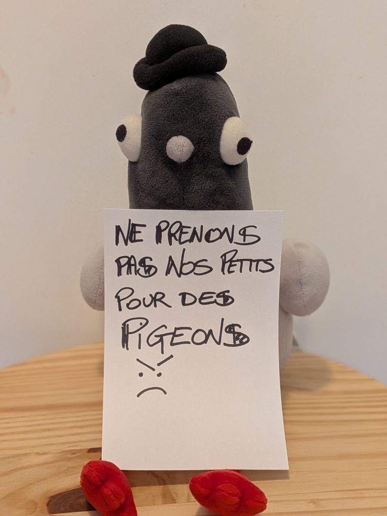 Stuffed pigeon holding a sign reading “Ne prenons pas nos petits pour des pigeons” (Let’s not take our little ones for fools)